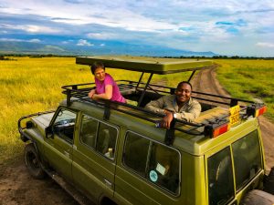 Safari vehicle watching elephants in Queen Elizabeth National Park on a Uganda Rwanda Safari