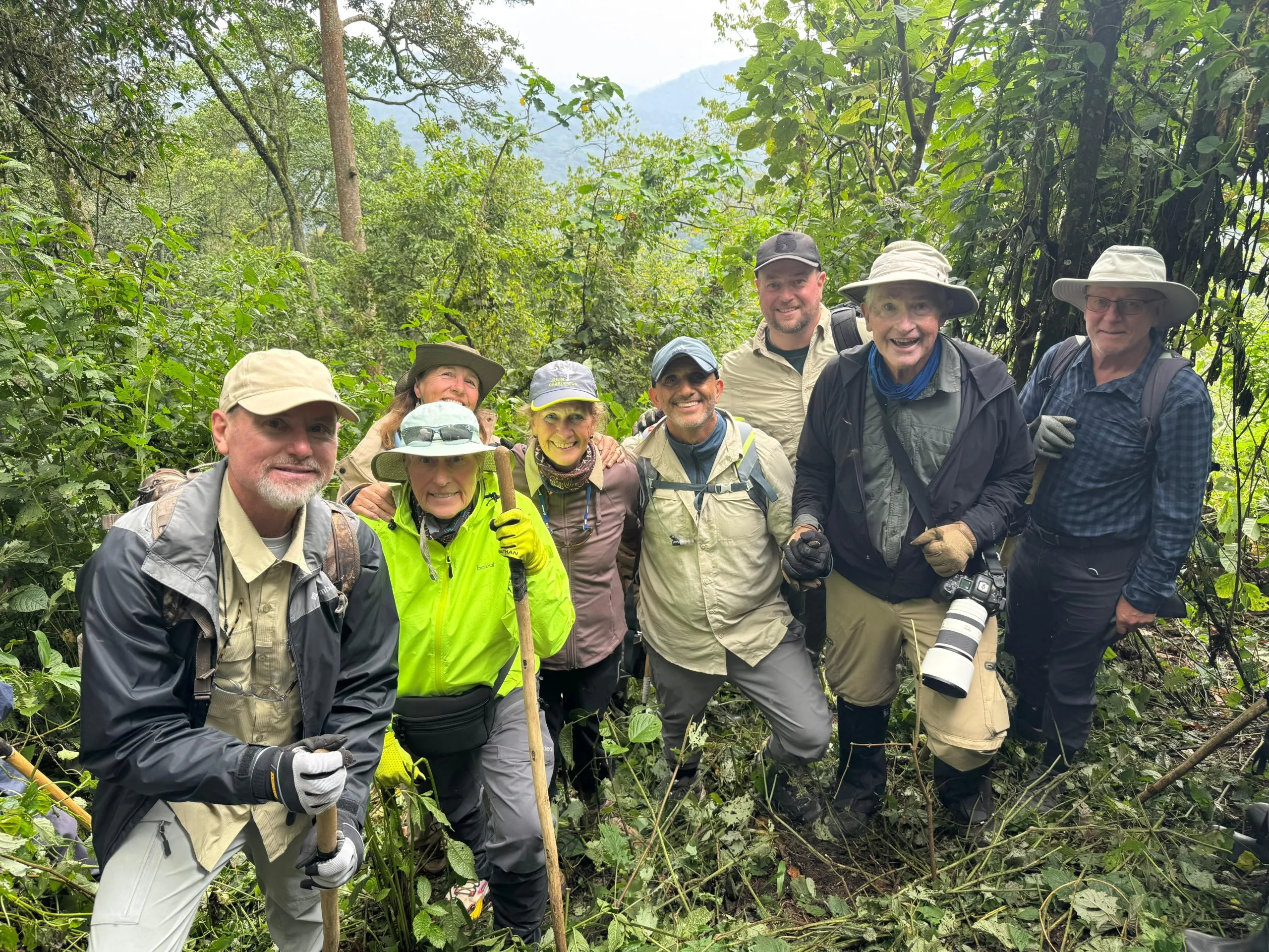Gorilla trekking group with ranger guide in Bwindi National Park, Uganda, during October