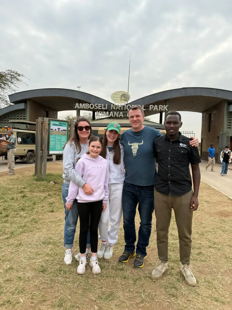 Tourists pausing for a photo at Amboseli National Park Kimana Gate in June Kenya safari
