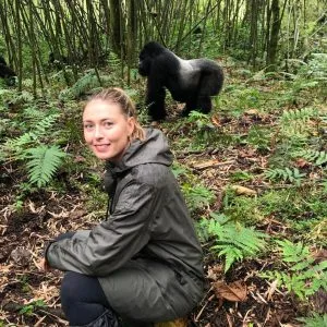 Traveler enjoying exclusive gorilla encounter in Mgahinga National Park