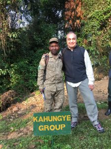 Tourist on budget gorilla trekking safari in Bwindi Uganda