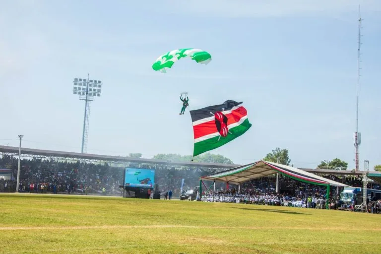 Kenyans celebrating Madaraka Day with flags and parades
