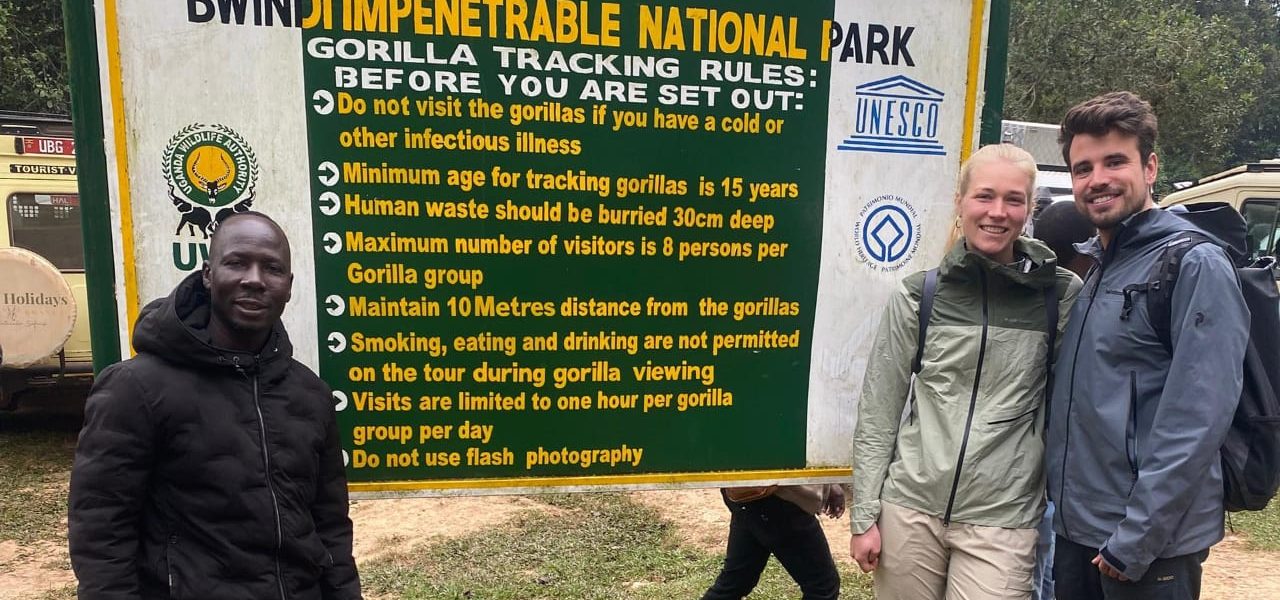 Uganda safari cost guide showing travelers exploring wildlife and landscapes in Uganda