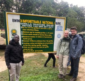 Uganda safari cost guide showing travelers exploring wildlife and landscapes in Uganda