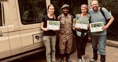 Native Africa Tours Guests showing off their Gorilla Trekking Certificate after their 1 hour with the Gorillas in the last summer