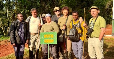 Our Guests on a Group photography safari pausing for a photo before there gorilla trekking expedition in Bwindi