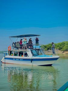 Tourists on a boat cruise on the kazinga Channel on Day 6 of their 10 Days Uganda Primates & Rhinos Safari