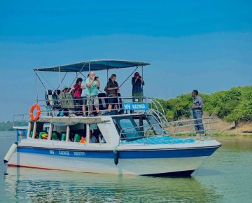 Tourists on a boat cruise on the kazinga Channel on Day 6 of their 10 Days Uganda Primates & Rhinos Safari