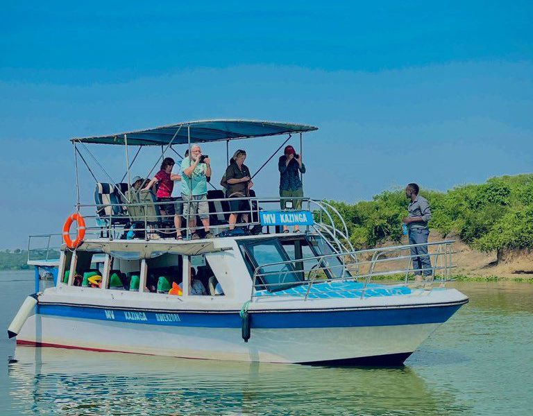 Tourists on a boat cruise on the kazinga Channel on Day 6 of their 10 Days Uganda Primates & Rhinos Safari