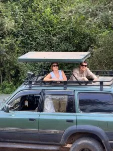A couple in our Open roof jeep in Lake Mburo National Park while on Day 4 of their Uganda Trip that started from Kigali Rwanda